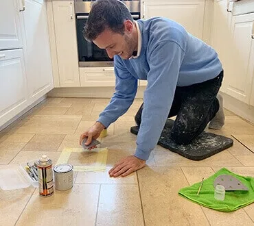 Surface Doctor technician carrying out a floor repair in a kitchen